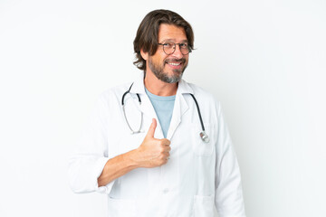 Senior dutch man isolated on white background wearing a doctor gown and with thumb up