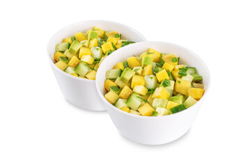 Mango avocado cucumber salad in a bowl on a white isolated background