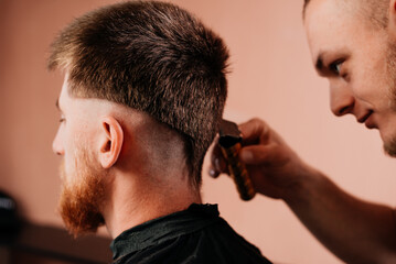 Fototapeta premium Haircut training at the barbershop