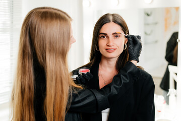 Fototapeta premium Using a brow brush with gel