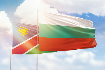 Sunny blue sky and flags of bulgaria and namibia