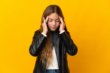 Child over isolated yellow background with headache