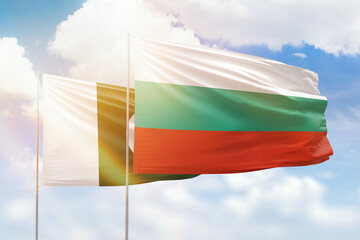 Sunny blue sky and flags of bulgaria and pakistan