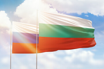 Sunny blue sky and flags of bulgaria and russia