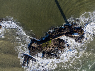 Maritime lighthouse on beautiful beach crossing with river - Itacaré, Bahia, Brazil
