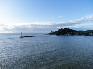 Maritime lighthouse on beautiful beach crossing with river - Itacaré, Bahia, Brazil