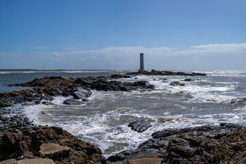 Maritime lighthouse on beautiful beach crossing with river - Itacaré, Bahia, Brazil