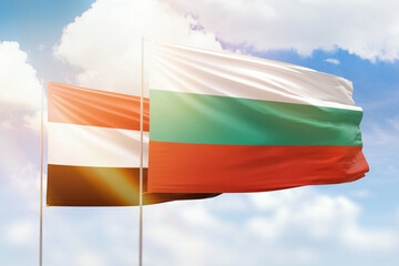 Sunny blue sky and flags of bulgaria and yemen