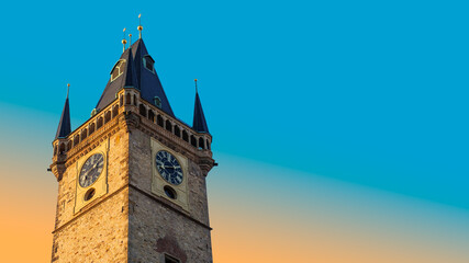 Fototapeta na wymiar Old Town Hall on sunset with ancient clock on tower in historic downtown of Prague, Czechia. Medieval landmarks and architecture of Europe for travel agency banner with place for text on blue sky.