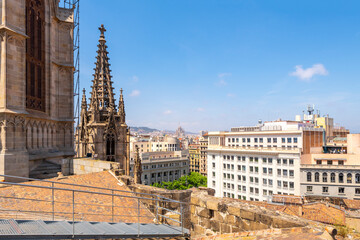 View of the Sagrada Familia Church designed by Gaudi from the rooftop viewing terrace of the Barcelona Cathedral in the El Born district.