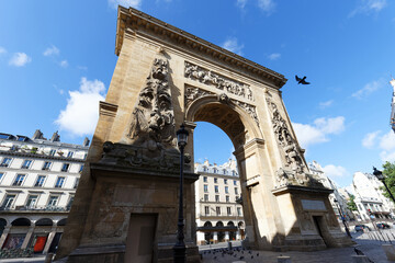 Fototapeta na wymiar Porte Saint-Denis is a Parisian monument located in the 10th district of Paris, France.