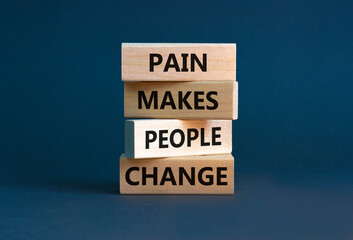 Pain makes people change symbol. Concept words Pain makes people change on wooden blocks on a beautiful grey table grey background. Business, motivational and pain makes people change concept.