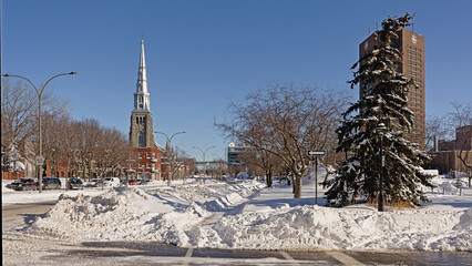 Church of St. Peter the Apostle and Boulevard Rene-Levesque in the snow