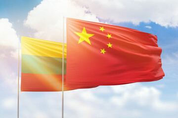 Sunny blue sky and flags of china and lithuania