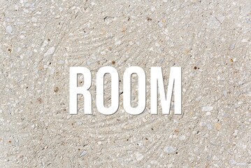 ROOM - word on concrete background. Cement floor, wall.