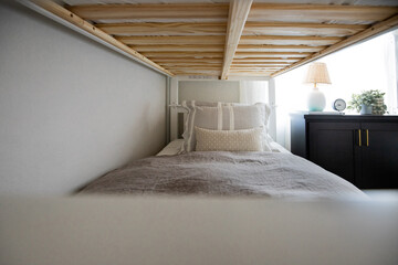 Bunk bed with neutral throw pillows