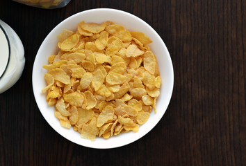 Cornflakes in a white bowl.  