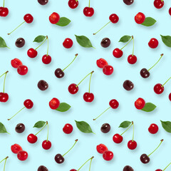 Cherry seamless pattern on blue background. Berry pattern. Summer background. Top view, flat lay.