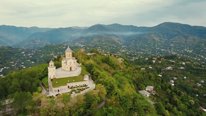 Fototapeta na wymiar awesome aerial shot of Sameba Holy Trinity Cathedral Church, green and magnificent landscape. High quality photo