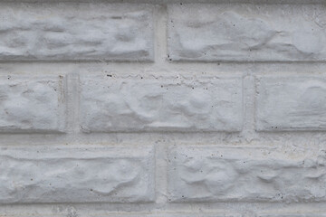 Wall of white bricks close-up