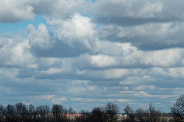 White and thick clouds in a blue sky. Cloudy sky.