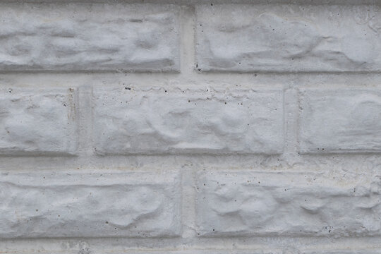 Wall of white bricks close-up