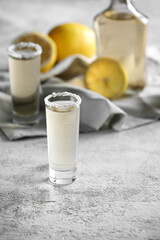 Shots of tasty mexican tequila on grey background
