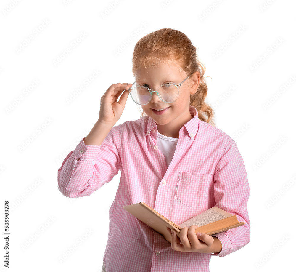 Sticker Little redhead girl in eyeglasses with book on white background