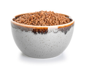 Bowl with buckwheat on white background