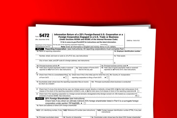 Form 5472 documentation published IRS USA 43416. American tax document on colored