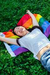 Woman lying on a lesbian flag