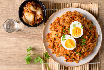 Korean kimchi fried rice with boiled egg, Table top view