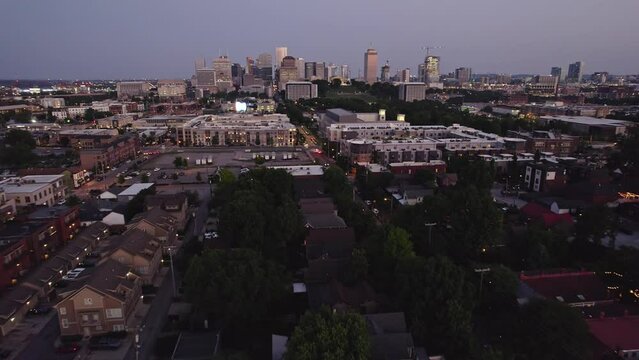 Aerial Shot of Nashville Neighborhood with Cityscape in Background at Dusk - Nashville, TN