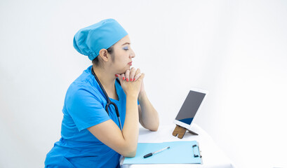 beautiful woman lab technician wearing uniform and blue surgical cap, in video call to give results, on white background