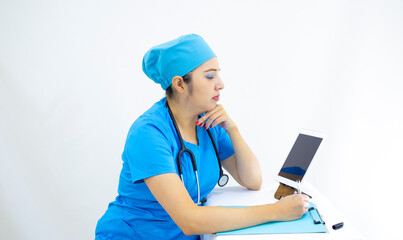 beautiful woman lab technician wearing uniform and blue surgical cap, in video call to give results, on white background