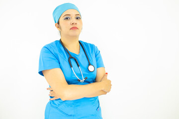 Beautiful female doctor wearing uniform and blue surgical cap,  professional woman with stethoscope on her neck on white background