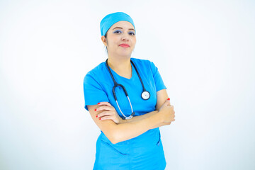 Beautiful female doctor wearing uniform and blue surgical cap,  professional woman with stethoscope on her neck on white background