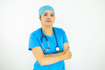 Beautiful female doctor wearing uniform and blue surgical cap,  professional woman with stethoscope on her neck on white background