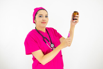 beautiful woman medical assistant wearing uniform and pink surgical cap, stethoscope, preparing injection on white background
