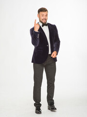 cheerful man in a jacket with a bow tie posing isolated on a light background