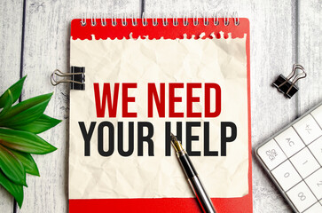 we NEED YOUR HELP,. the inscription on the business card is attached to the notebook.