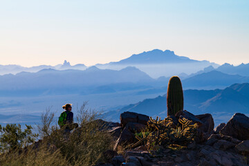 Woman enjoying the view after a hike up Sunrise Trail in Scottsdale, Arizona. - obrazy, fototapety, plakaty