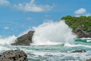 Natural view of the coast in Indonesia when the weather is sunny. Karang Tawulan beach tourism in Indonesia