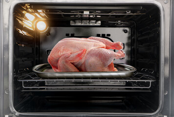 Whole raw turkey in the oven - obrazy, fototapety, plakaty