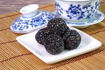 Black sesame ball, Chinese super food reduce oxidation in the body, improve blood pressure, and provide antioxidants and other plant chemicals that help fight cancer. Selective focus with copy space