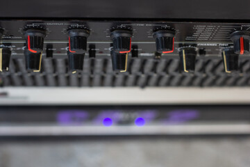 Slide and knob to adjust the sound frequency equalizer.