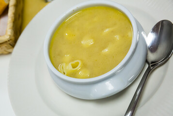 Bowl of tasty pasta bouillon served in white bowl