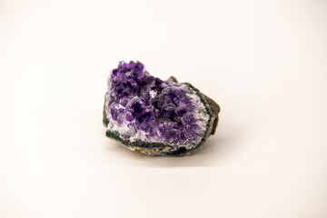 Isolated on white amethyst geode, background, purple gemstone, colleection of natural stones and...