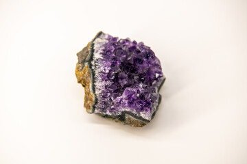 Amethyst geode isolated on the white background, purple gemstone, close up image with copy space for text