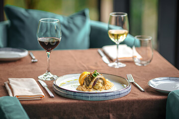 Served restaurant table with wine drinks and food